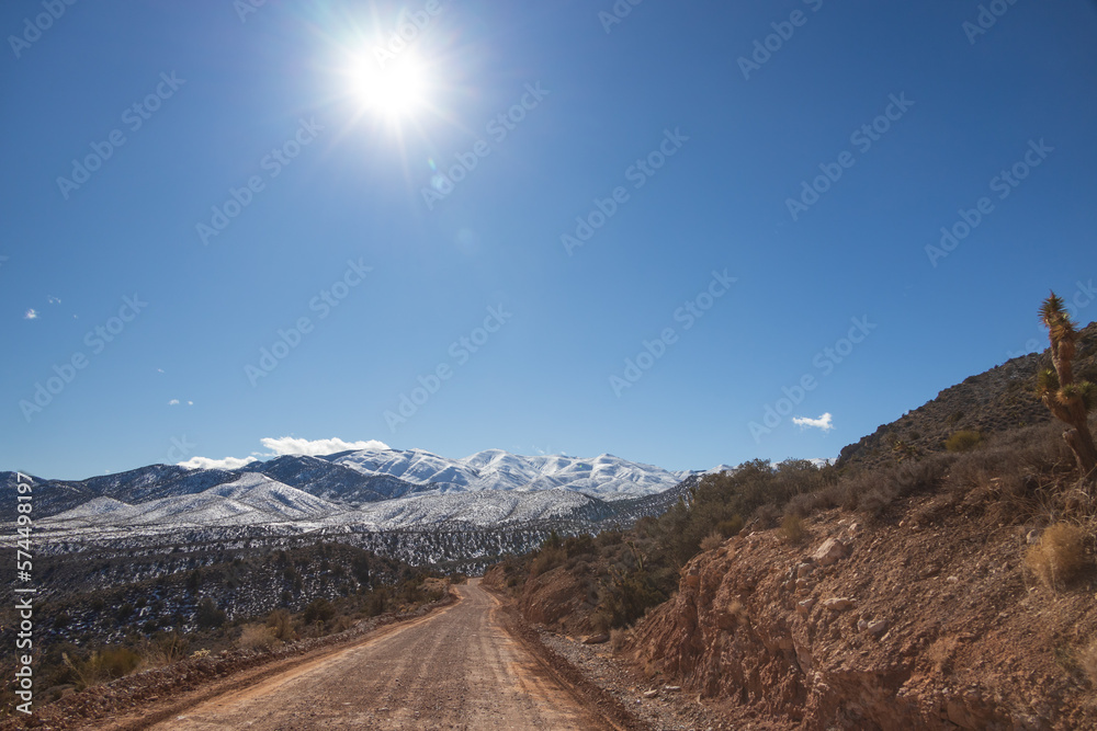 Dirt road and snow covered ground at Spring Mountain National Recreation Area, Nevada
