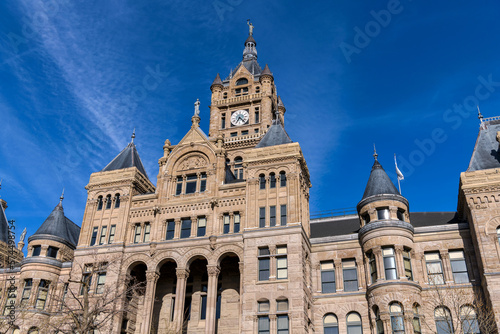 Salt Lake City and County Building - A low-angle and wide-angle view of the historic Salt Lake City and County Building, against blue sky, on a sunny Winter evening. Downtown of Salt Lake City, Utah.