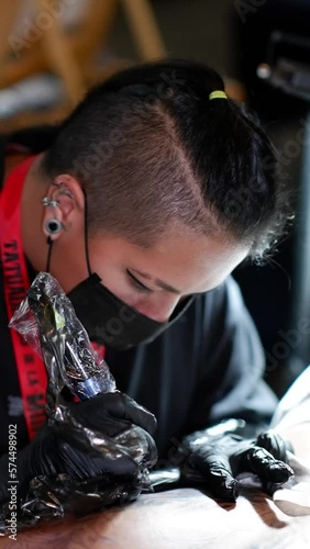 Focused Tattooing, Watch a Skilled Artist Work with Black Ink