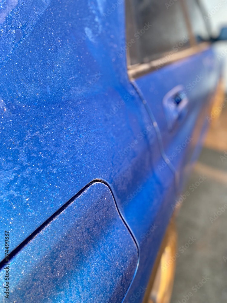 Frost on blue car