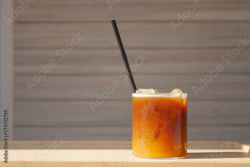 Iced coffee with orange in coffee shop