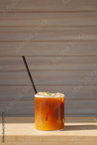 Iced coffee with orange in coffee shop