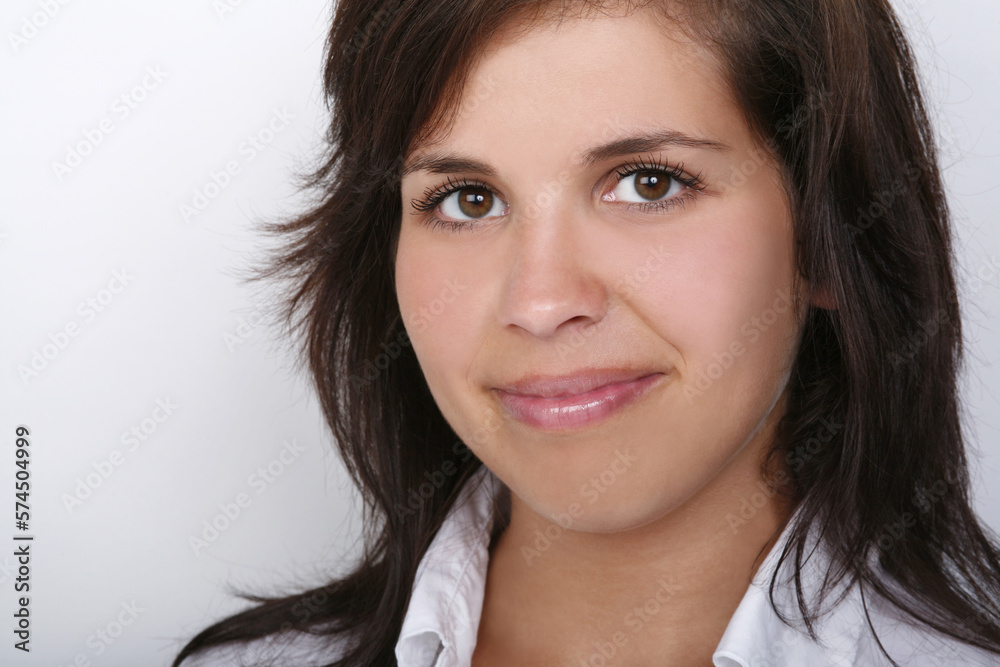 Close up portrait of smiling attractive young woman with white background. Close up portrait of smiling attractive young woman with white background.