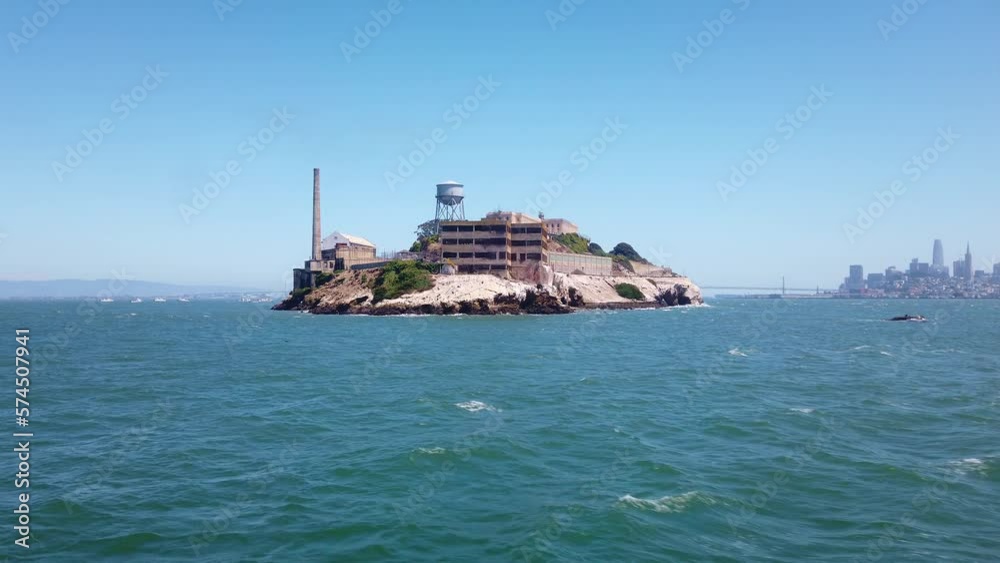 Gimbal moving shot approaching the backside of Alcatraz Island by boat with the Bay Bridge and San Francisco visible in the background. 4K Gimbal moving shot approaching the backside of Alcatraz Island by boat with the Bay Bridge and San Francisco visible in the background. 4K