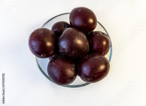 photo of plum on a plate, isolate