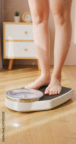 woman measure weight on scale