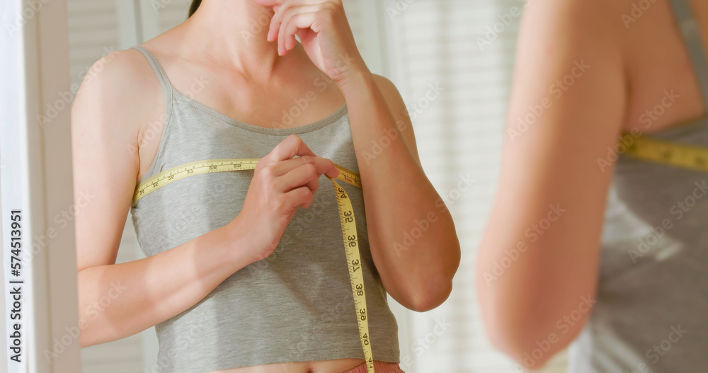 Fototapeta premium woman measure chest and breast