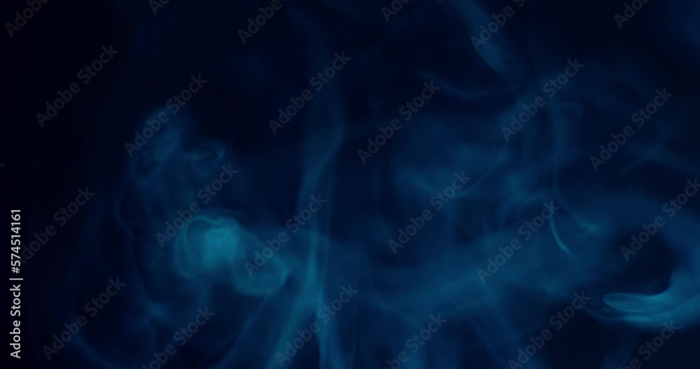 Beautiful swirling colorful smoke on black