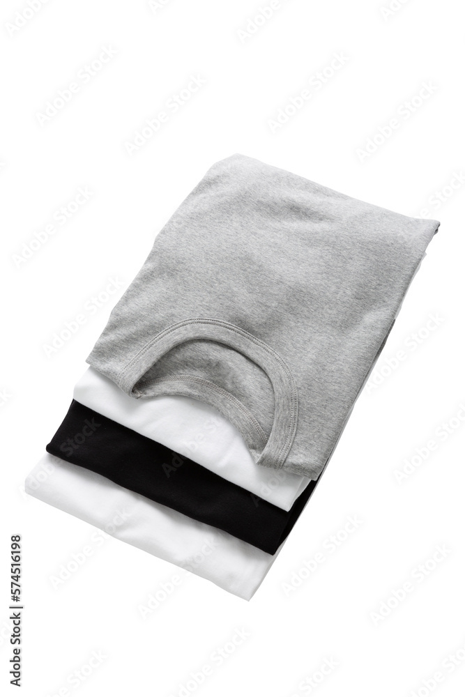 White,grey and black T-shirts folded group on background White,grey and black T-shirts folded group on background