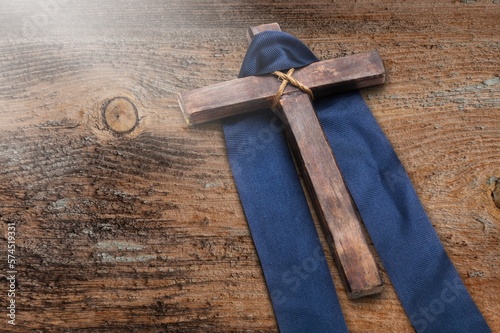 Classic christian wooden cross on desk