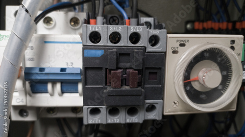 Timer control  circuit with contactor for control machine on the electric power panel.