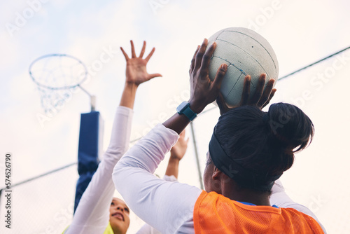 Billede på lærred Netball, goal shooter and fitness of a girl athlete group on an outdoor sports court