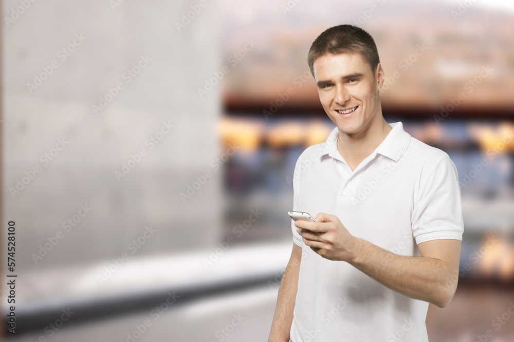 Happy young person using phone at room Happy young person using phone at room