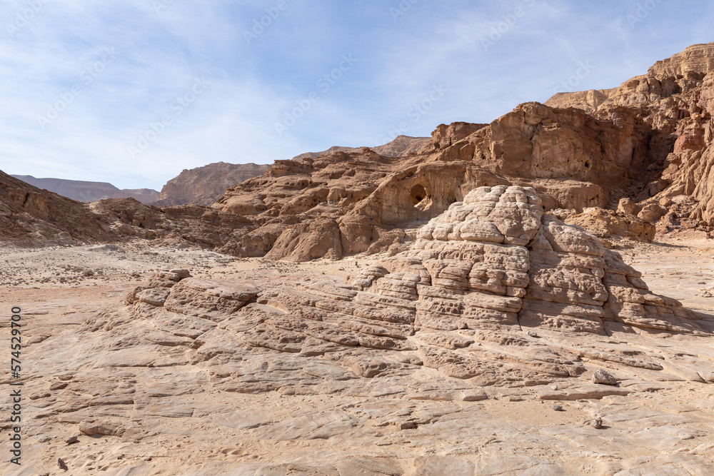 The famous  stone arch, resulting from the erosion of the rock, in the midst of fantastically beautiful landscape in the national park Timna, near the city of Eilat, in southern Israel