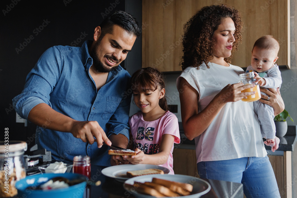 Hispanic family father and child daughter preparing breakfast at kitchen in Mexico Latin America Hispanic family father and child daughter preparing breakfast at kitchen in Mexico Latin America