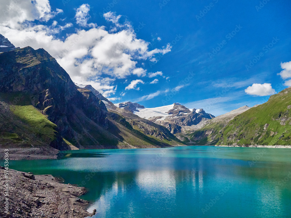 Panoramic view at glacier reservoir with blue sky