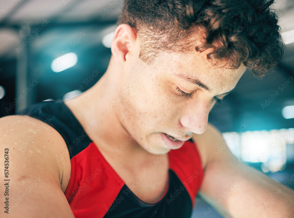 Fototapeta premium Fitness, sweat and man in gym, tired and exercise with wellness, healthy lifestyle and training. Sports break, male and athlete sweating, drops and exhausted after practice, workout and breathing