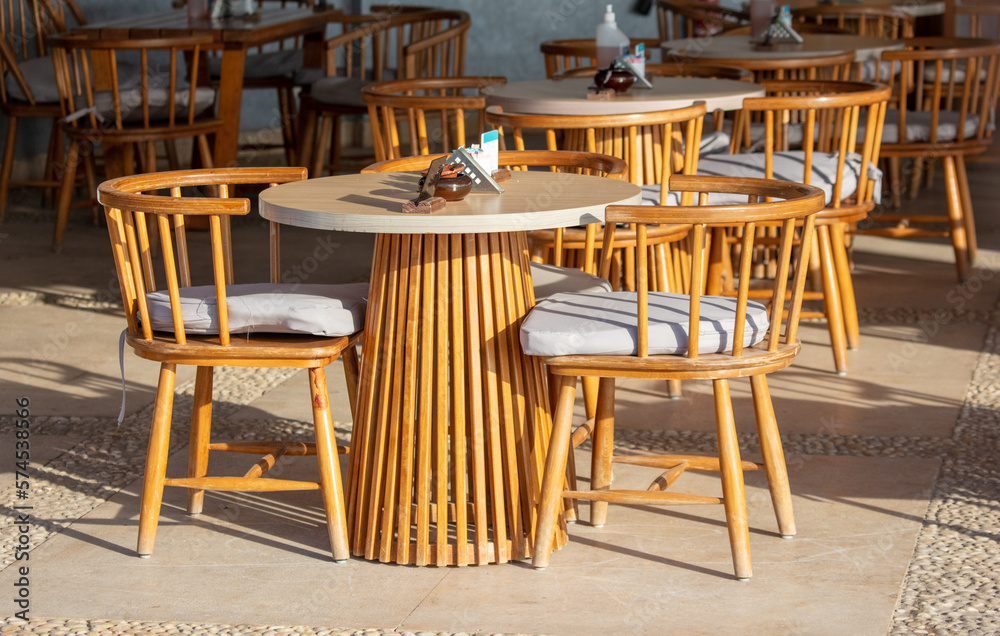 Tables with chairs in a cafe.