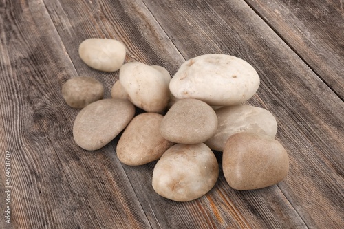 Rocks  natural stones pile on wooden desk