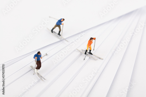 Miniature scene skiing on white paper