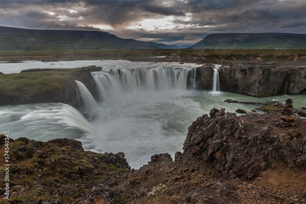 Beautiful Icelandic waterfall at sunset with huge quantity of flowing waters Iceland Beautiful Icelandic waterfall at sunset with huge quantity of flowing waters Iceland