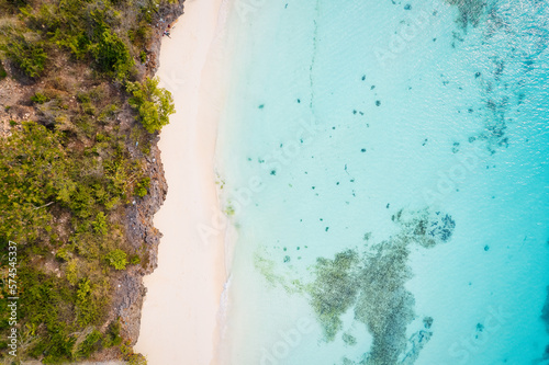 This drone shot of Nungwi Beach in Zanzibar captures the incredible beauty of the shoreline, with crystal-clear waters and golden sand providing a picture-perfect view.
