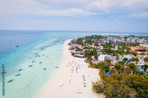 This drone shot of Nungwi Beach in Zanzibar captures the incredible beauty of the shoreline, with crystal-clear waters and golden sand providing a picture-perfect view. © Sebastian