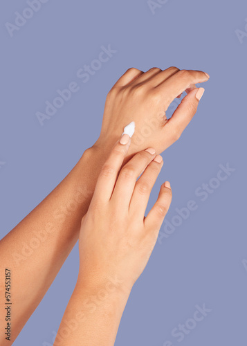 Hands  skincare and cream cosmetics in studio isolated on a purple background for hydration. Product  dermatology and woman or female model with lotion  creme or moisturizer for beauty aesthetics.