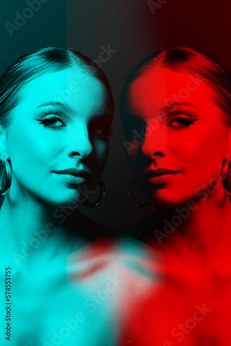 Beautiful woman portrait with make-up, classic hairstyle, naked shoulders and round earring standing in and looking at camera. Red and blue color split and 3D glitch virtual reality effect applied © Rytis
