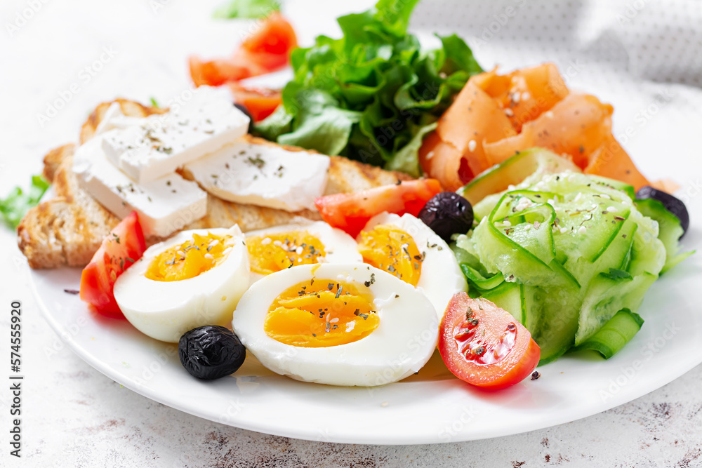 Healthy breakfast. Salad with feta cheese, eggs, cucumber and carrot. Healthy balanced food. Healthy breakfast. Salad with feta cheese, eggs, cucumber and carrot. Healthy balanced food.