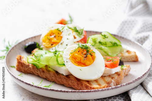 Healthy breakfast. Toast with feta cheese and egg. Healthy balanced food.