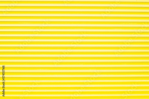 Bright yellow shop shutter as a texture, template, blank