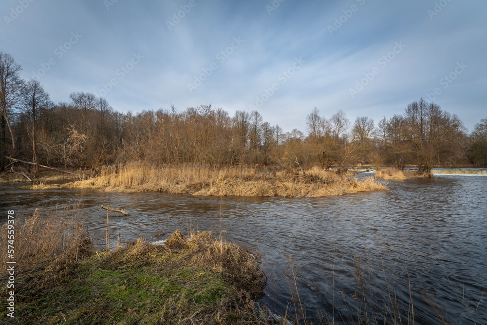 The Warta River in the month of February at the heights of the city of Dzialoszyn, Poland.