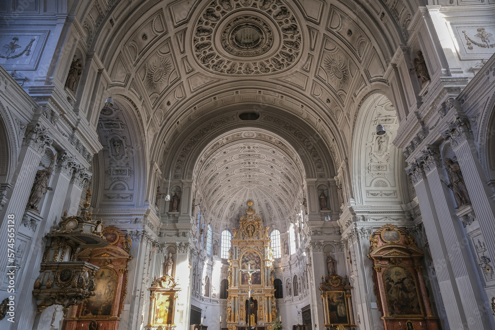 Magnificent opulent splendid Bavarian baroque church cathedral basilica interiors with stucco, murals, altar, Pilars, ceiling paintings, gold, wood domes nave