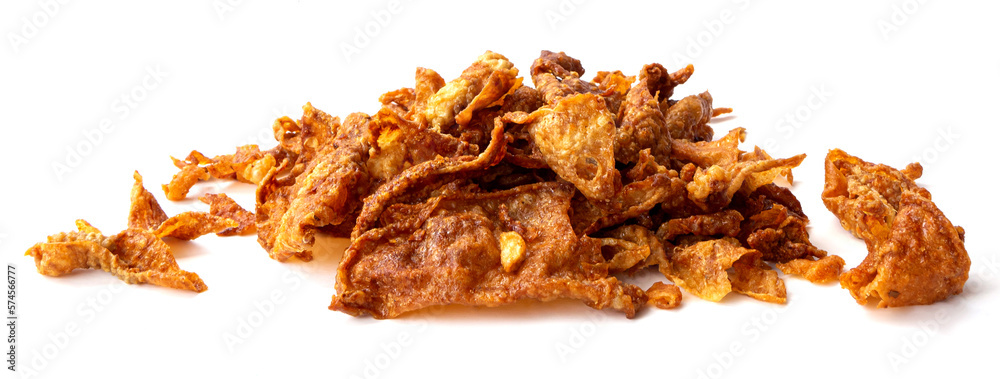 Crispy fried chicken skin on white background, snack food. Crispy fried chicken skin on white background, snack food.
