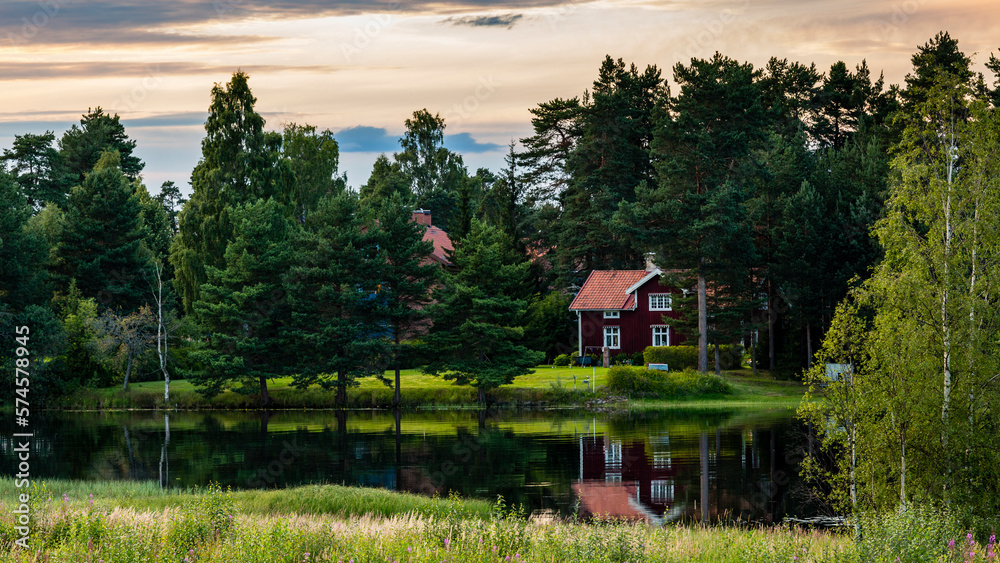 Typical Swedish house surrounded by trees, Mora, Dalarna, Sweden