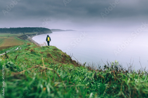 A man hikes in the rain on the Puget Sound's Whidby Island in Washington. photo