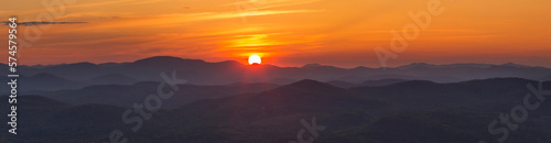 Panoramic view from Buck Mountain summit at sunset with Gore Mountain visible, Adirondack Mountains, New York State, USA photo