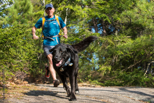 Trying to keep up with a four legged friend on the trail photo