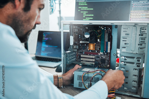 It technician, engineer and computer hardware with a man working to fix or maintenance technology. Hands of expert IT person in office data center for system repair, engineering or motherboard update