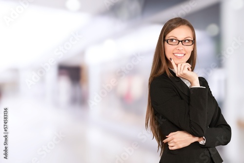 Happy young woman with glasses posing
