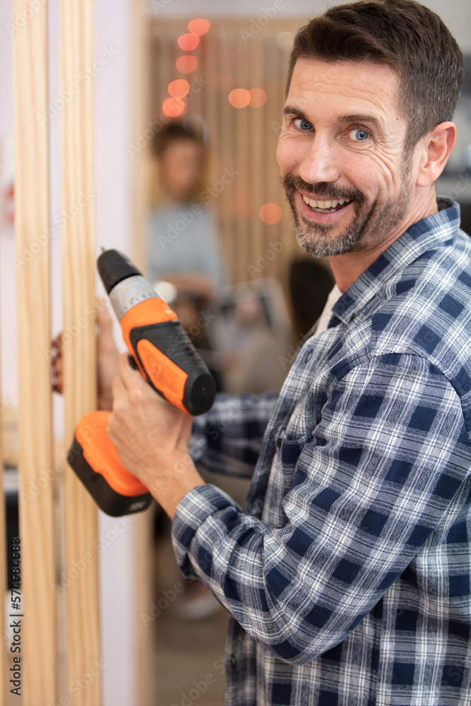 builder or worker drilling with a machine or drill builder or worker drilling with a machine or drill