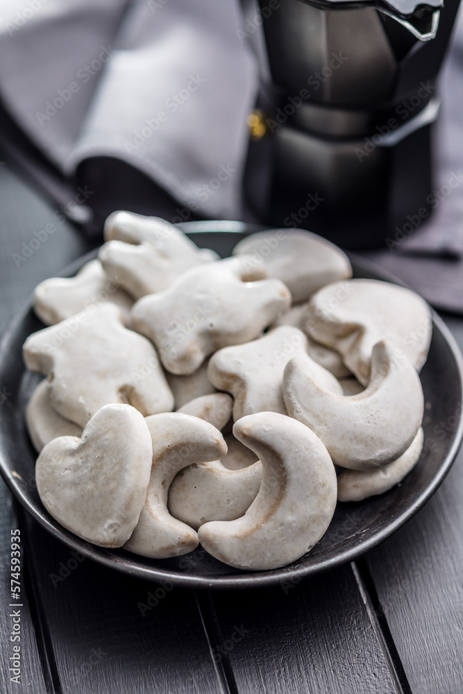 Gingerbread cookies with the sugar icing on plate. Gingerbread cookies with the sugar icing on plate.