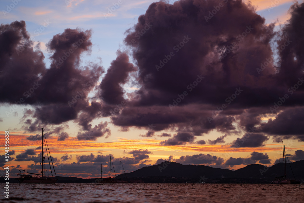 Dramatic landscape with sunset on the sea shore. Beautiful cloudy sky. Dramatic landscape with sunset on the sea shore. Beautiful cloudy sky.