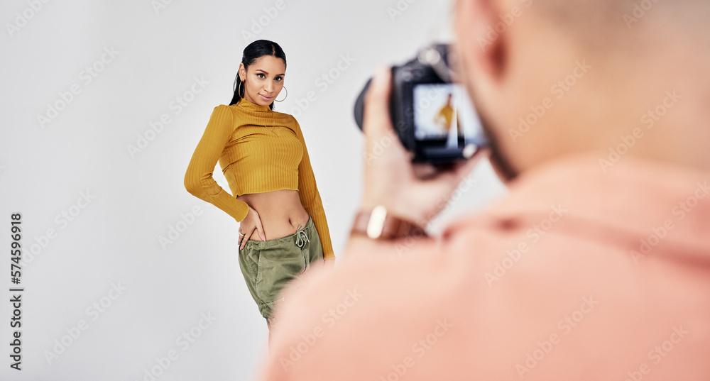 © Courtney H/peopleimages.com - Camera, photographer and photography with woman fashion model in studio for creative, advertising and image. Media, backstage and professional man with girl and equipment for photoshoot capture