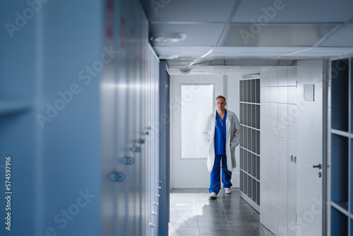 A male doctor came to the locker room after a work shift at the hospital.