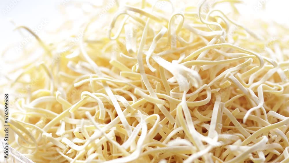 natural noodle-shaped pasta rotates smoothly in a circle natural noodle-shaped pasta rotates smoothly in a circle