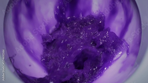 Dirty water is pouring into a white toilet. slow motion