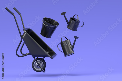 Garden wheelbarrow with garden tools like water can, rake and bucket on violet