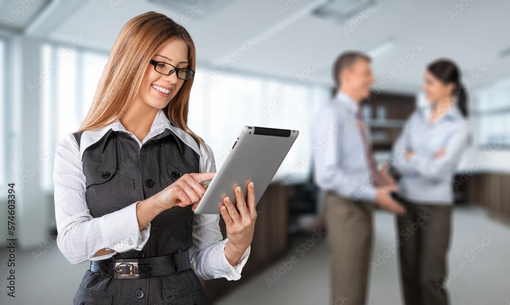 Young business woman in office working Young business woman in office working
